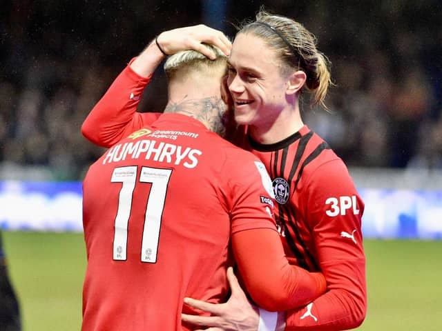 Thelo Aasgaard accepts the congratulations off Stephen Humphrys after competing his hat-trick at Peterborough