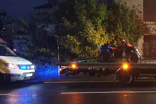 The quad bike being taken away by police