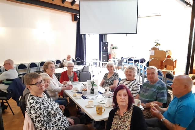Regular customers enjoying breakfast at the Cafe