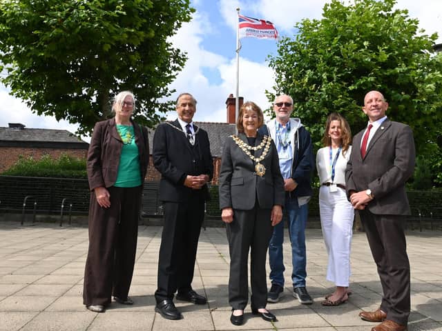 Coun Susan Gambles, Mayor's consort Coun Andrew Bullen, Mayor of Wigan Coun Jenny Bullen, Coun Keith Cunliffe, director of public health Rachael Musgrave and Coun Martyn Smethurst, lead member for armed forces and veterans, at the raising of the Armed Forces Day flag on Believe Square