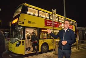 Greater Manchester mayor Andy Burnham with a Bee Network bus