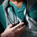 BLACKBURN, ENGLAND - MAY 14: A Junior Doctor holds his stethoscope during a patient visit on Ward C22 at The Royal Blackburn Teaching Hospital in East Lancashire, during the current coronavirus disease (COVID-19) epidemic, on May 14, 2020 in Blackburn, England.  (Photo by Hannah McKay - Pool/Getty Images)