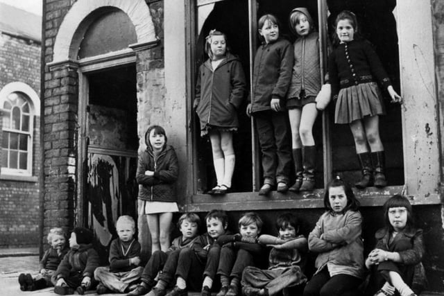 RETRO 1971 - A group of friends gather in James Street, Lower Ince, Wigan, to play among the derelict homes and corner shops which were due for demolition.