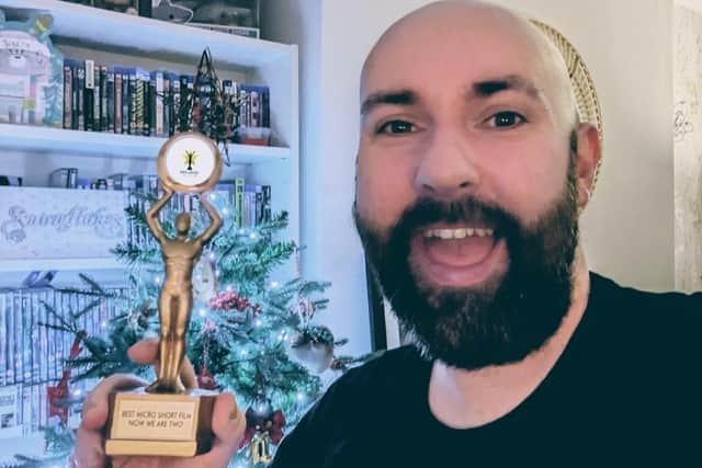 Justin Walker with the award