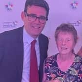 Barbara Lambert, volunteer chairman of the League of Friends at Wrightington Hospital, collects an award from Greater Manchester Mayor Andy Burnham, with volunteer services manager Laura Milward