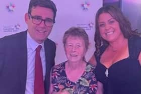 Barbara Lambert, volunteer chairman of the League of Friends at Wrightington Hospital, collects an award from Greater Manchester Mayor Andy Burnham, with volunteer services manager Laura Milward