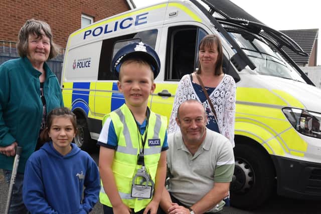George Latham visited the police station with his grandmother Carole Welch, cousin Leah Welch, 11, dad Mark Latham and mum Donna Latham