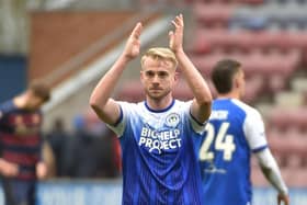 Jack Whatmough salutes the Latics fans after Saturday's 1-0 victory over QPR