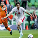 James Carragher shields the ball from Memphis Depay during Malta's World Cup qualifier against Holland in midweek