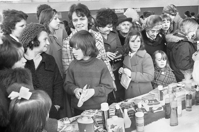 A typical Saturday afternoon photographic assignment on the 27th of March 1976 and bargain hunters at The Deanery High School bazaar.