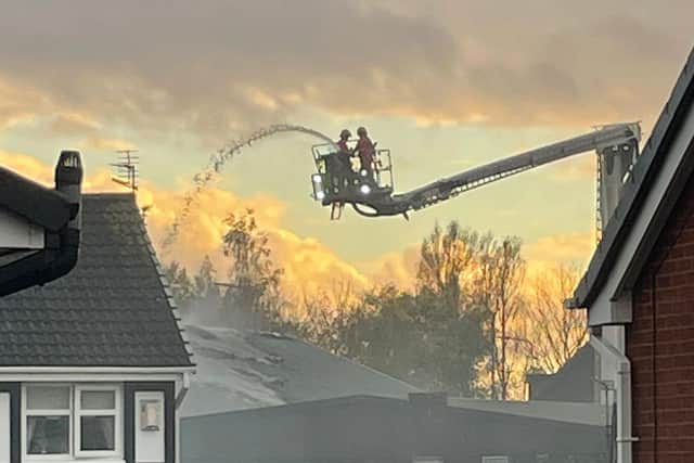 Firefighters using the borough's aerial platform tackle the blaze from above
