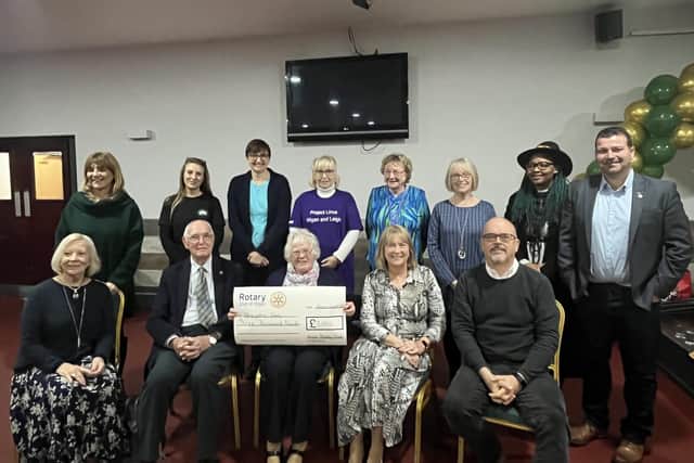 Wigan Rotary Club members present cheque to previous recipients