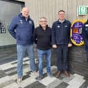 Pine Villa FC's Paul Lingard, Coun Chris Ready, Standish Leisure Centre's general manager Gary Highton and senior leisure assistant Aaron Wragg with the new defibrillator outside the leisure centre