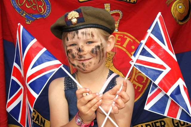 Wigan Armed Forces Day and parade along Standishgate and Market Place followed by a service at the memorial in the grounds of the Parish Church.
Pictured is Elle Eccles, six.
