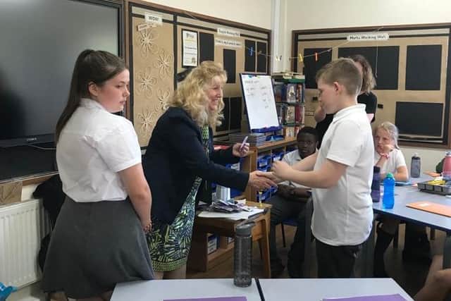 The students receiving their badges