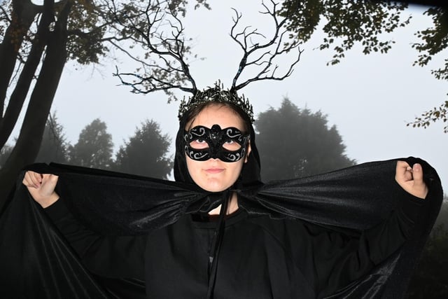 Visitors attend in spooky fancy dress at the Halloween pumpkin event at Haigh Woodland Park.