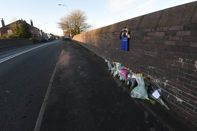 Flowers at the scene of a hit and run where Gareth "Gaz" Roper died: the bridge on Lily Lane, Bamfurlong