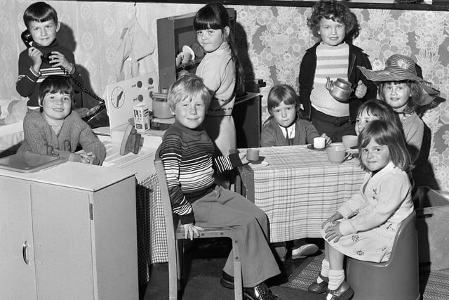 Infant children in a homely scene at Beech Hill Primary School in June 1977.