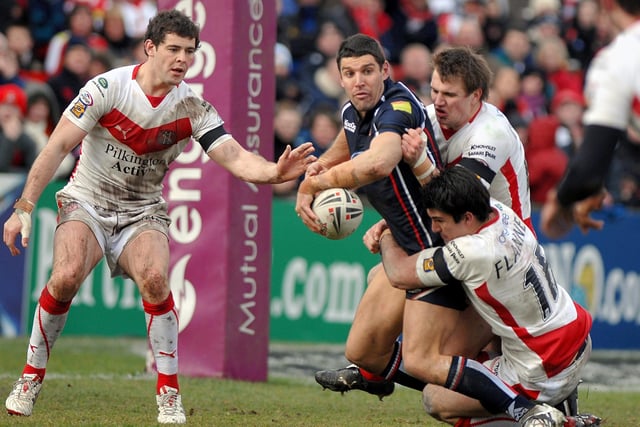 Trent Barrett tries a backhander to Thomas Leuluai but the pass went to ground. St Helens v Wigan Warriors, 21st March 2008