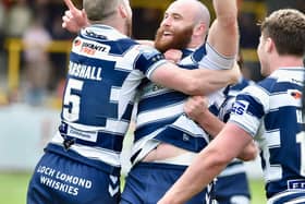 Jake Bibby celebrates with Liam Marshall