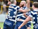 Jake Bibby celebrates with Liam Marshall