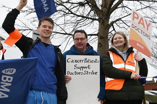 Junior doctors and supporters on the picket line outside Wigan Infirmary earlier this year
