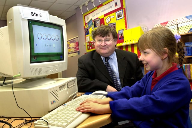 Ian McCartney with pupil, Leah Sergeant, in the IT suite after the official opening of Worsley Mesnes Community Primary School. 
