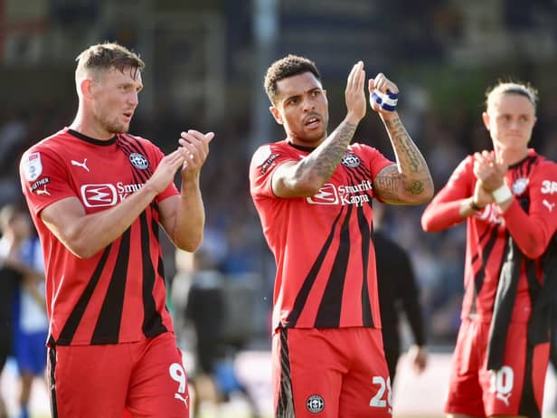 Charlie Wyke (far left) thanks the traveling fans who endured a tough afternoon at Bristol on Saturday