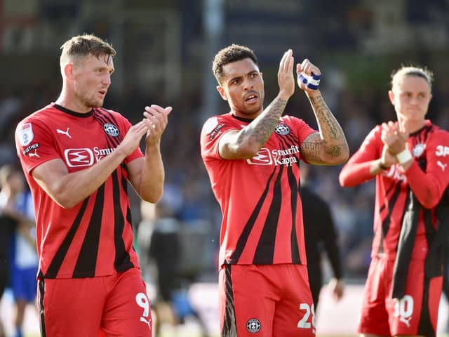Charlie Wyke (far left) thanks the traveling fans who endured a tough afternoon at Bristol on Saturday