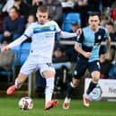Ronan Darcy looks to pick a pass in the draw at Wycombe