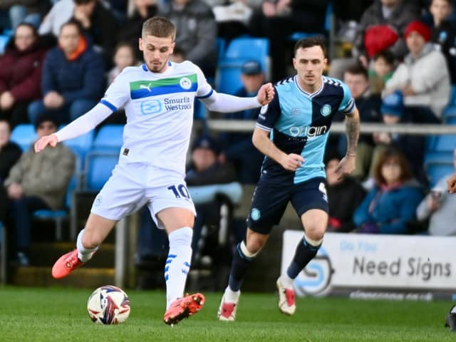 Ronan Darcy looks to pick a pass in the draw at Wycombe