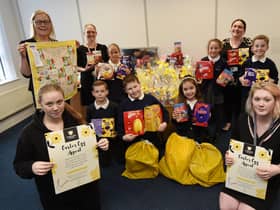 Year five pupils and staff from St Mary's Primary School in Ince deliver the Easter eggs to Daffodils Dreams