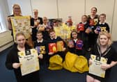 Year five pupils and staff from St Mary's Primary School in Ince deliver the Easter eggs to Daffodils Dreams