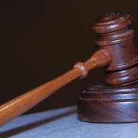 Frightening a woman for weeks by repeatedly following her has earned a Wigan man a suspended jail term