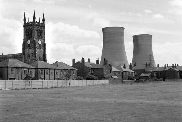 A view of Poolstock with St Thomas and St  James Church and Westwood Power Station cooling towers.