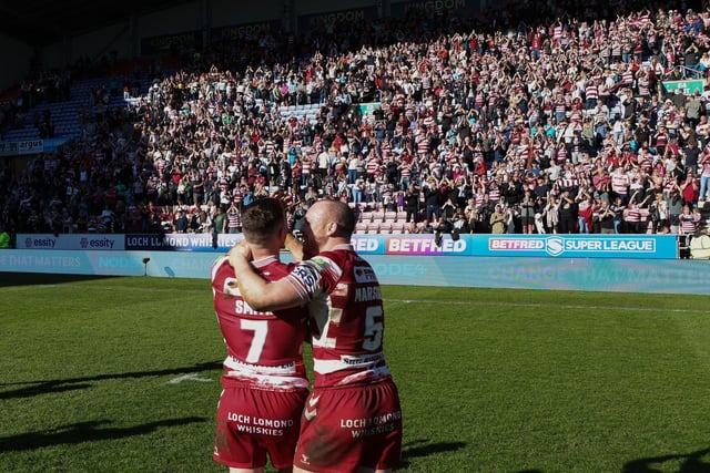 Harry Smith and Liam Marshall celebrate in front of the Wigan fans.