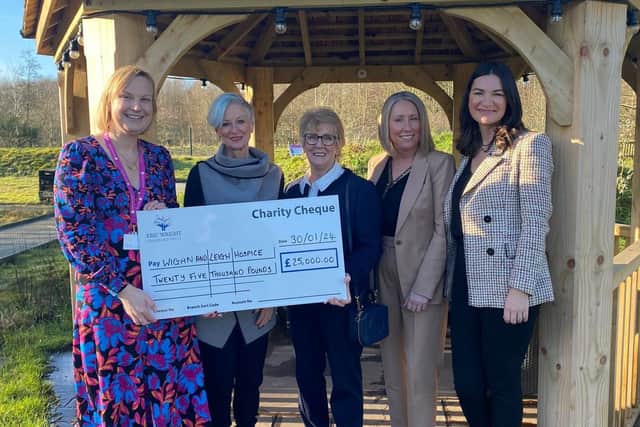 Representatives from the Eric Wright Charitable Trust visited Wigan and Leigh Hospice to hand over a cheque for £25,000