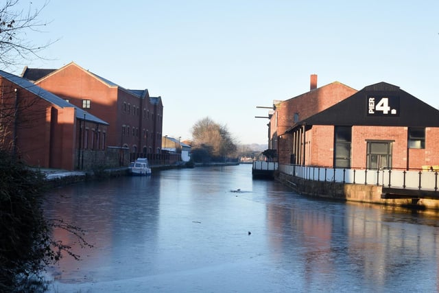 Sections of the Leeds Liverpool canal are frozen over at Wigan Pier.