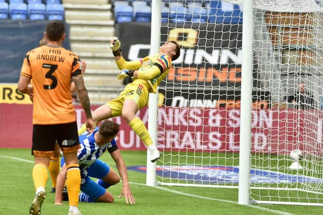 Fine goalkeeping from Will Mannion helped to keep out Latics until the second half