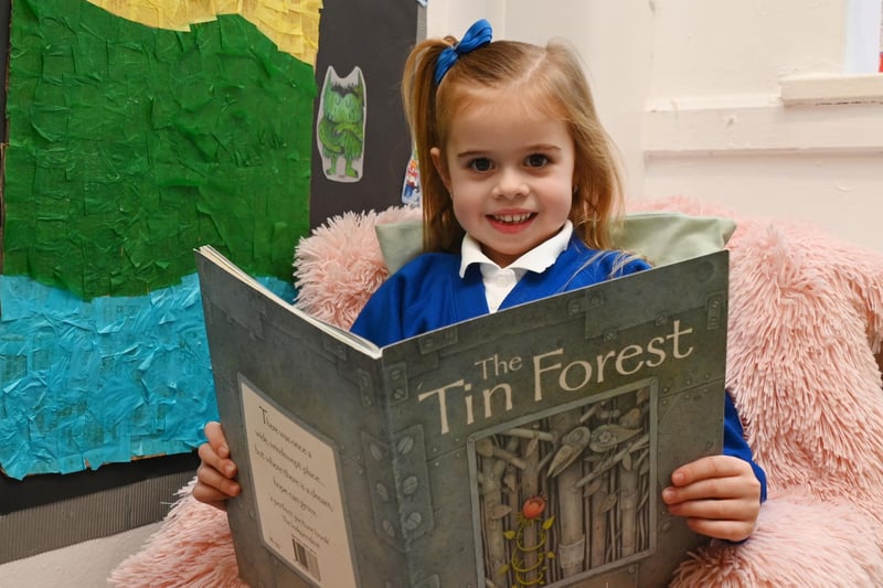 Year One pupils in their woodland-themed winning reading area.