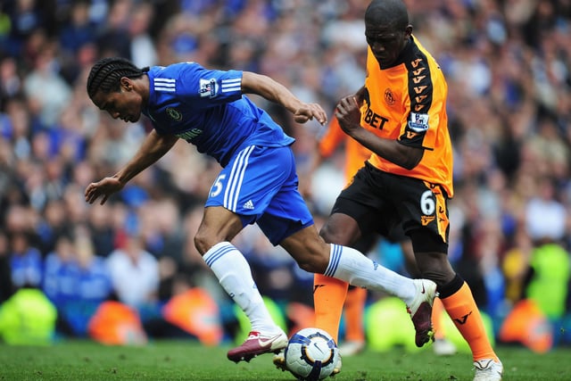Hendry Thomas of Wigan Athletic tackles Florent Malouda of Chelsea during the Barclays Premier League match between Chelsea and Wigan Athletic at Stamford Bridge on May 9, 2010 in London, England.