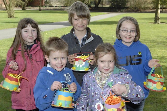 Easter Fun at Haigh Hall included Egg Rolling and Easter Bonnet making, pictured with their bonnets, from left,  Emma, Ben, Felix, Olivia and Louise.