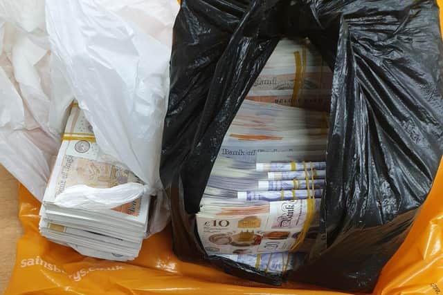 Some of the £50,000 in cash seized by police in Wigan