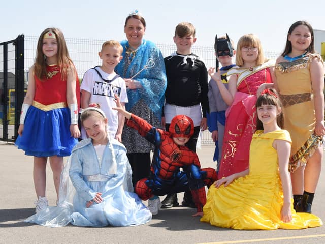 Staff and pupils dressed as superheroes and princesses in memory of Holly Prince