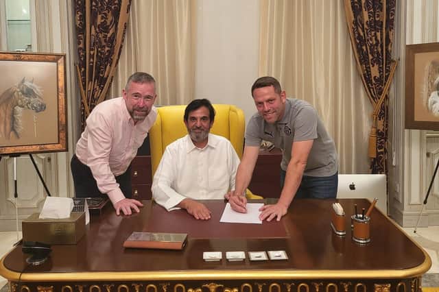 Leam Richardson, with Latics chief executive Mal Brannigan and club owner Abdulrahman Al Jasmi