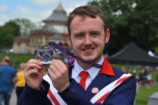 Jordan Gaskell with his medal for completing 70 miles for 70 years on the throne for the jubilee. 
Family fun at the Jubilee Party in the Park, with food, stalls and entertainment, celebrating the Queen's platinum Jubilee at Mesnes Park, Wigan.