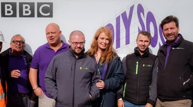 Liam Richards (third from left) and Michael Cummins (second from right) with the DIY SOS team