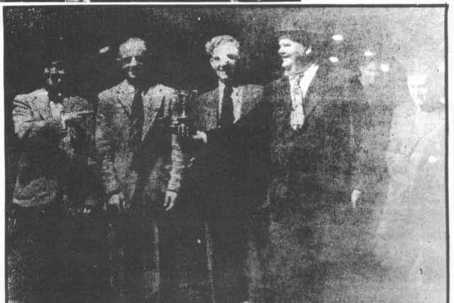 Laurel and Hardy with, left to right between them, Oliver and Ron Hart who owned Poolstock Greyhound and Speedway Track