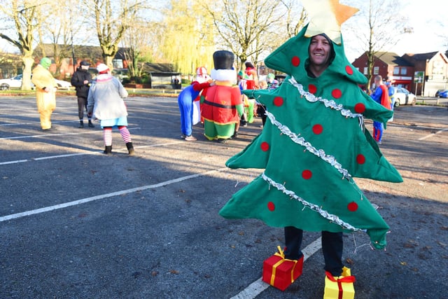 The event organiser, local plasterer Tony Taylor, 47, who lives in Hindley Green with his wife Kerry and two daughters. He walked dressed as a Christmas tree.