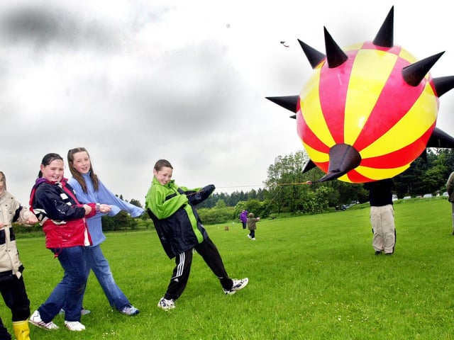 The pulling power of these youngsters helps to launch this monster at the Kite Festival at Beacon Park organised by the North West Sports and Power Kite Group and West Lancs Ranger Service on Sunday 9th of June 2002.